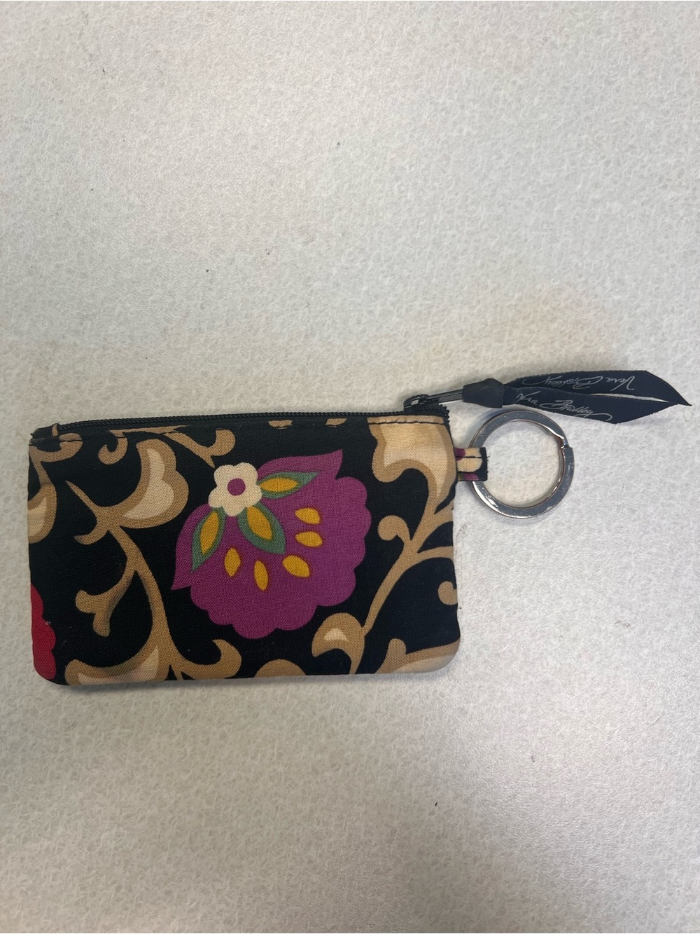 Zip ID case is featured in the retired “Suzani”pattern with floral design.